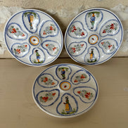 A Set of Three Henriot Quimper Six Piece Oyster Plates