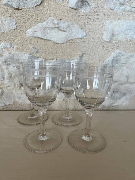 A Set of Four Etched Wine Glasses